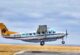Small aircraft landing on Masai Mara airstrip on a fly-in safari from Nairobi