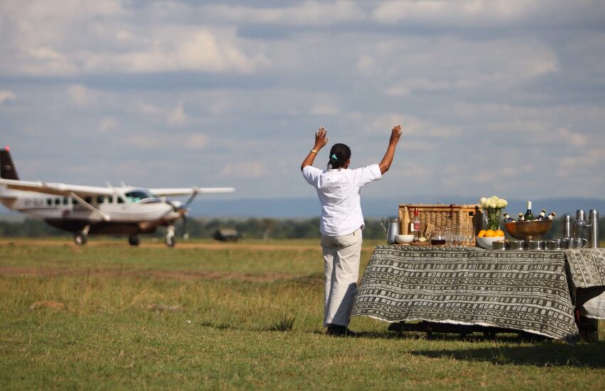Small plane landing on Masai Mara airstrip on a 3-day fly-in safari from Nairobi