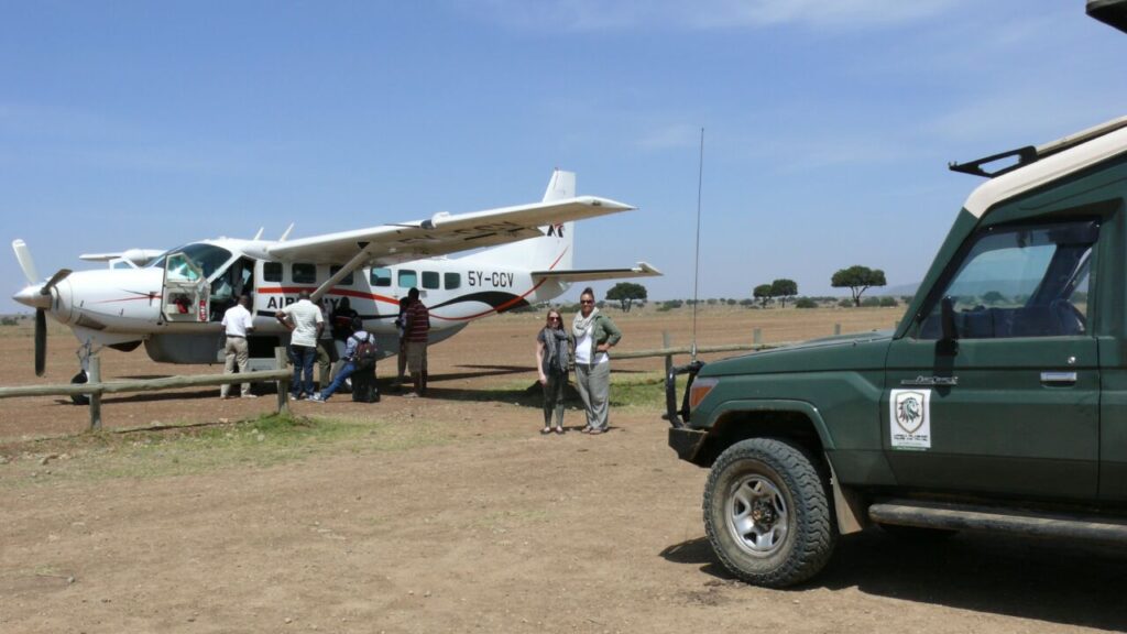Small plane landing on Masai Mara airstrip on a 2-day fly-in safari from Nairobi