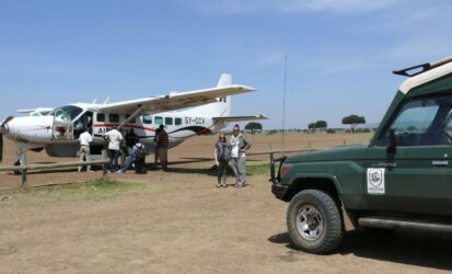 Small plane landing on Masai Mara airstrip on a 2-day fly-in safari from Nairobi
