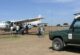 Small plane landing on Masai Mara airstrip on a 2-day fly-in safari from Nairobi