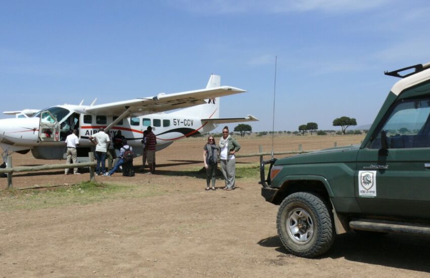 Small plane landing on Masai Mara airstrip on a 2-day fly-in safari from Nairobi