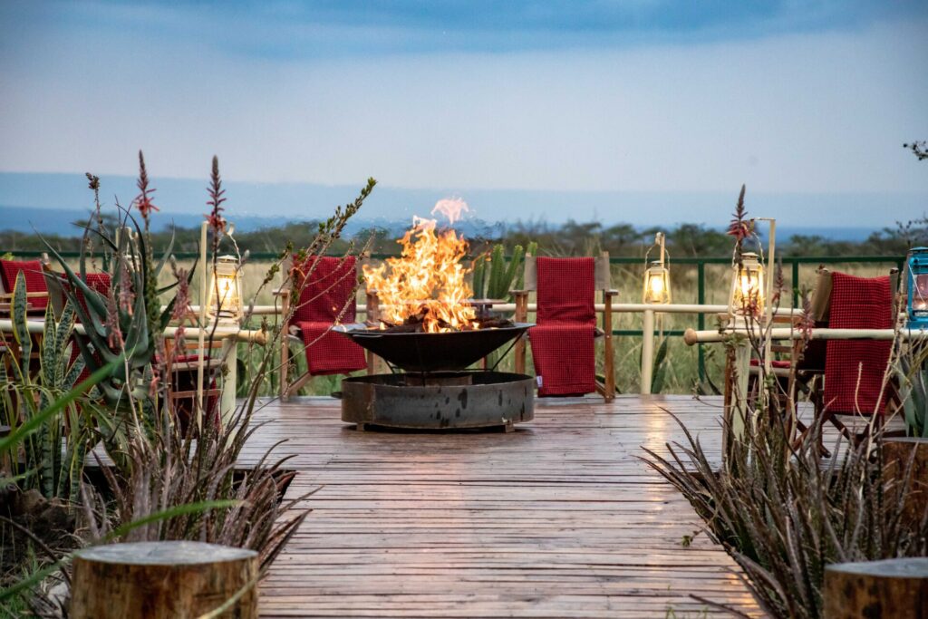 Sundowner drinks overlooking the Mara plains at Zebra Plains Mara Camp 1