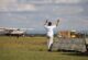 Small aircraft landing on Masai Mara airstrip on a fly-in safari from Mombasa
