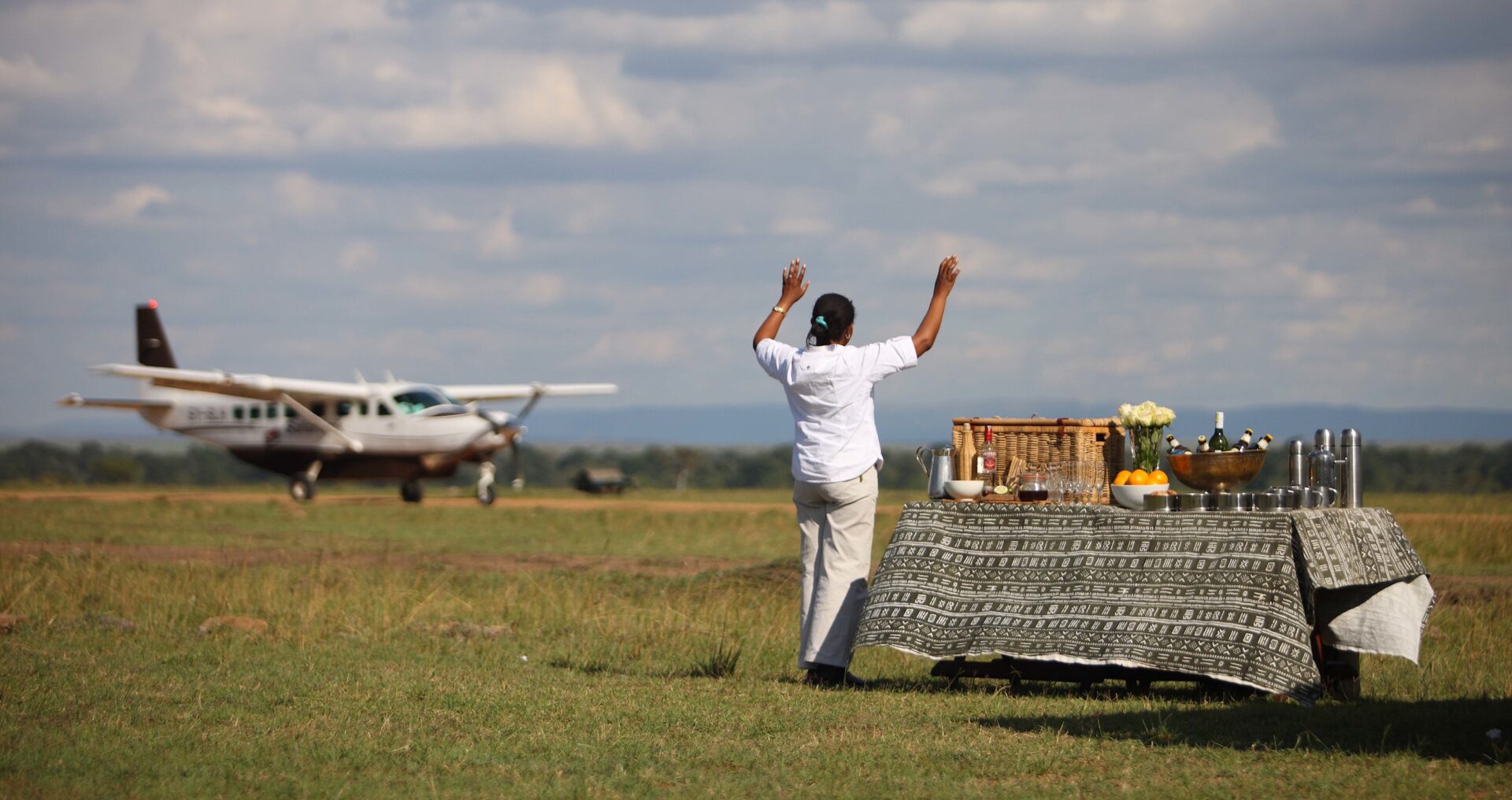 Small aircraft landing on Masai Mara airstrip on a fly-in safari from Mombasa