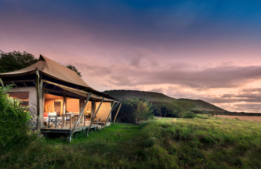 Sunset over the Masai Mara plains seen from a luxury tented camp