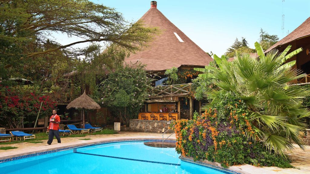 Spend leisure time poolside at Masai Mara Sopa Lodge in the Masai Mara | Flashmctours