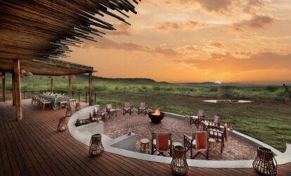 Luxury Kenya Honeymoon Safari lodge with a romantic sunset and dining terrace overlooking the African wilderness
