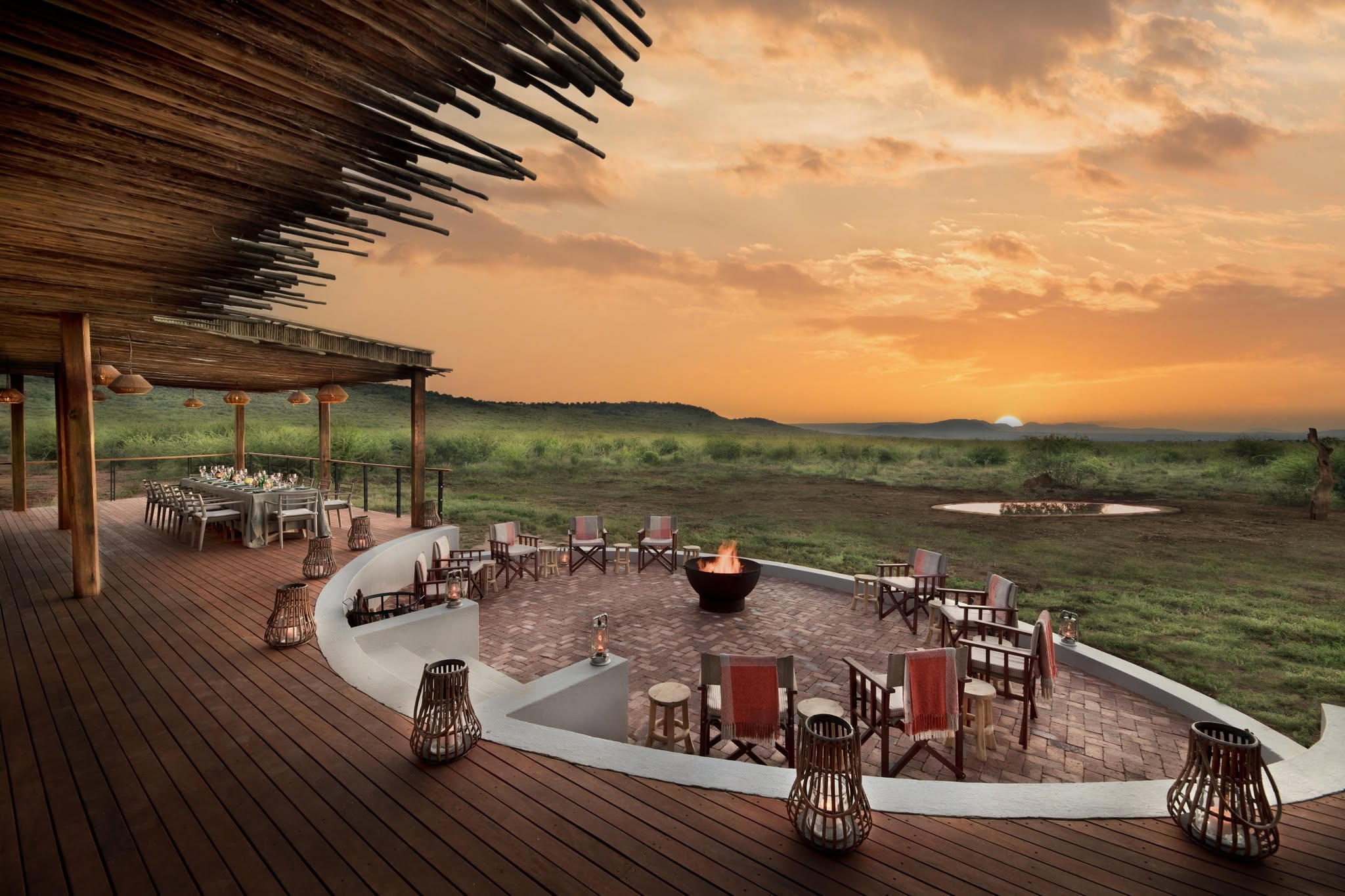 Luxury Kenya Honeymoon Safari lodge with a romantic sunset and dining terrace overlooking the African wilderness