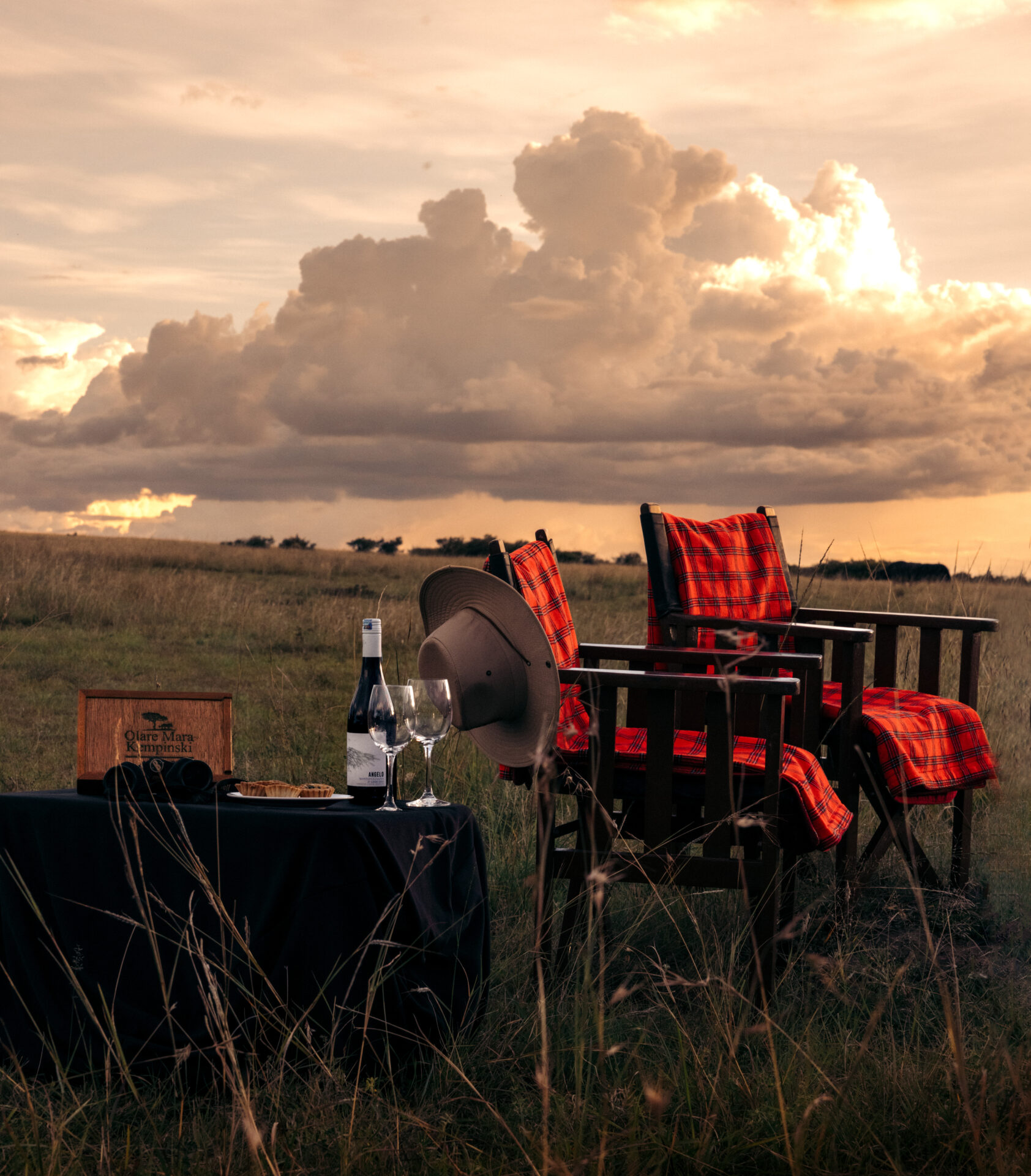 Romantic bush sundowner with wine and sunset views during a luxury Tanzania Honeymoon Safari